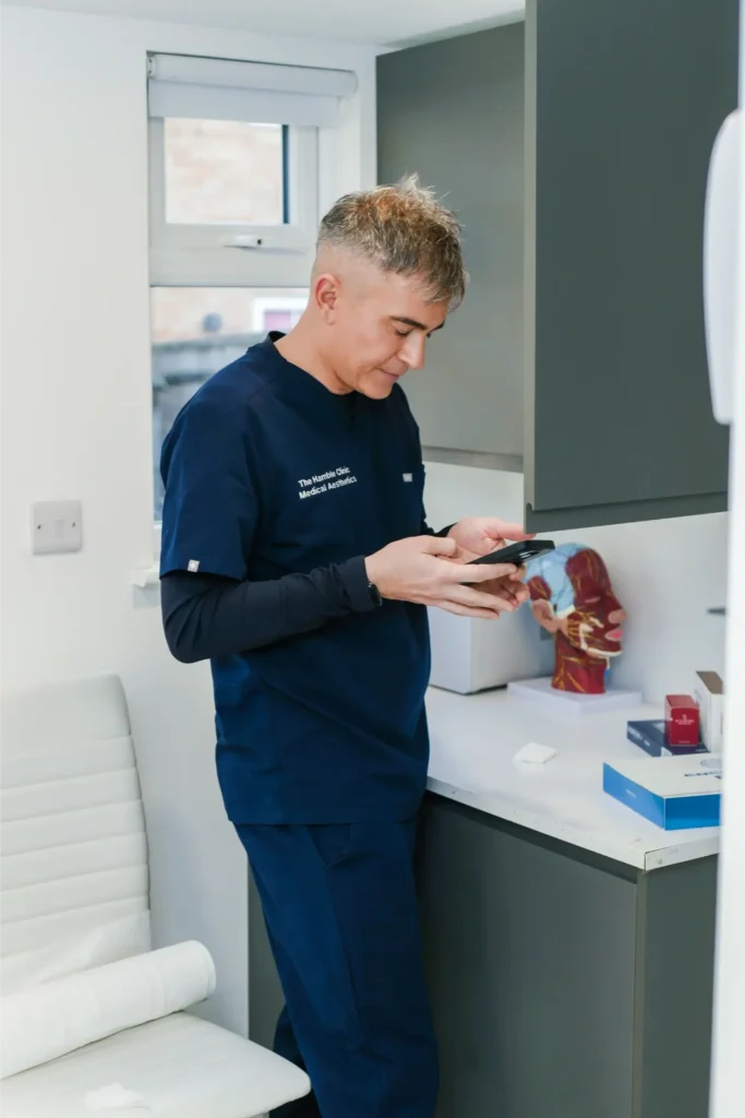 Stuart looking at his phone