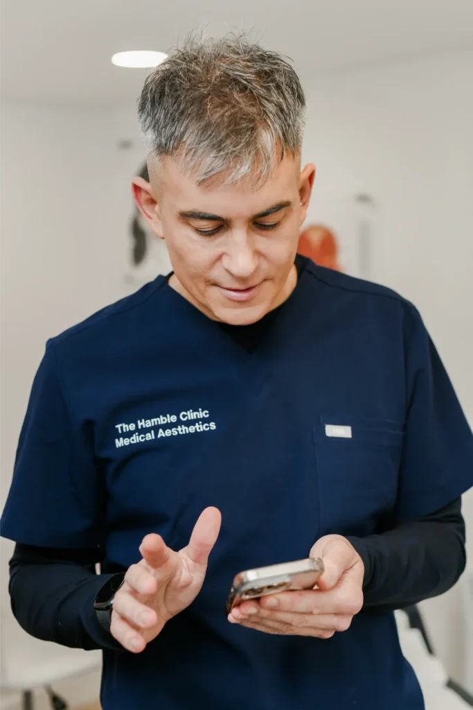 Stuart looking at his phone