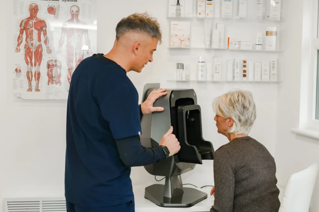 Stuart preparing a patient for a skincare consultation